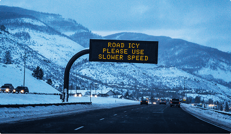 Electronic highway sign warning of icy roads